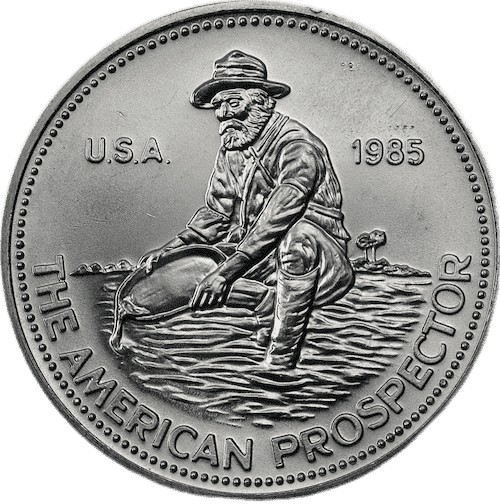 Engelhard Silver Prospector hostoric coin.The obverse of the Silver Prospector shows a prospector kneeling by a stream, panning for gold. 